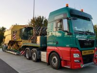/assets/images/a/M%C3%A4hdrescher%20Transport%20Meusburger%20Tiefbett-c9014484.jpg